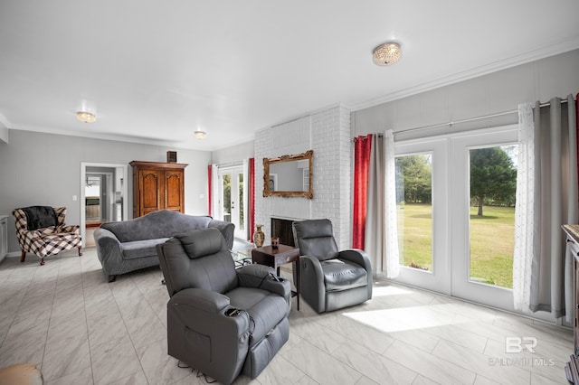 living room with crown molding, marble finish floor, a brick fireplace, and a healthy amount of sunlight