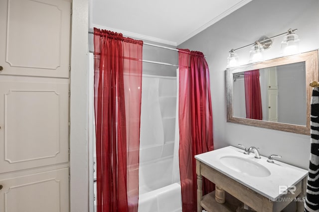 bathroom with a sink, ornamental molding, and shower / bath combination with curtain