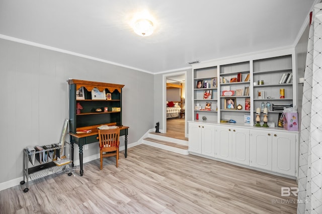 interior space with crown molding, baseboards, and light wood-style floors