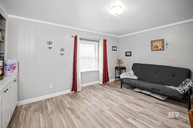 living room featuring crown molding, baseboards, and light wood-style flooring