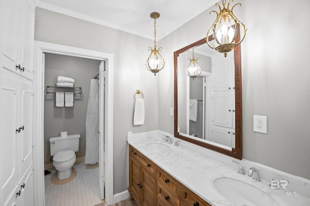 bathroom with double vanity, a sink, tile patterned flooring, and toilet