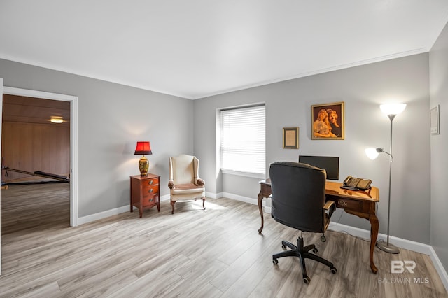 home office with baseboards, ornamental molding, and wood finished floors