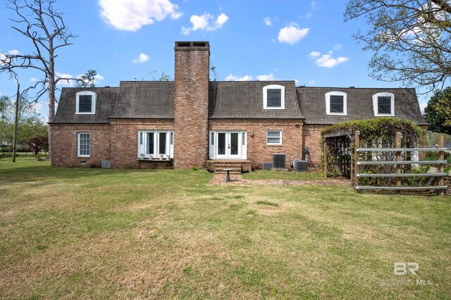 803 S Pensacola Ave, Atmore, AL 36502 - rear view of house with mansard roof, french doors, and brick siding
