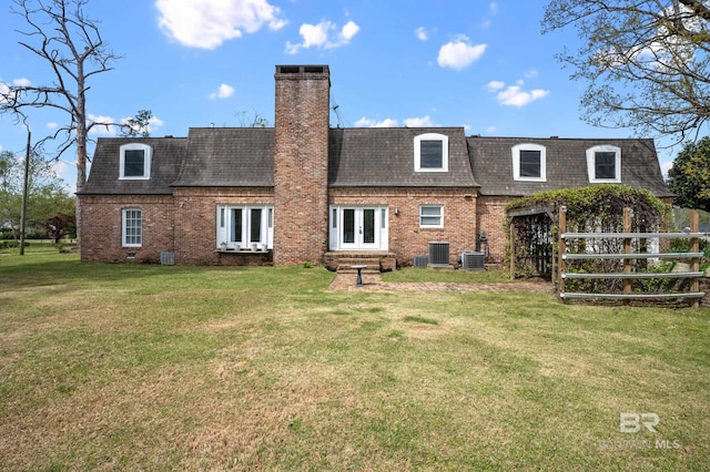 803 S Pensacola Ave, Atmore, AL 36502 - rear view of house with mansard roof, french doors, brick siding, and a shingled roof