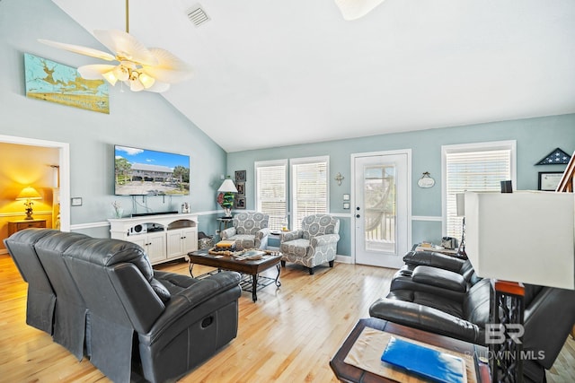 living room with vaulted ceiling, light hardwood / wood-style floors, and ceiling fan