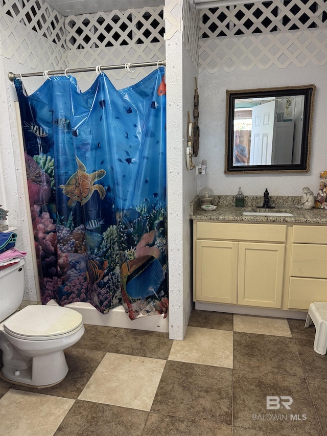 full bath featuring vanity and toilet