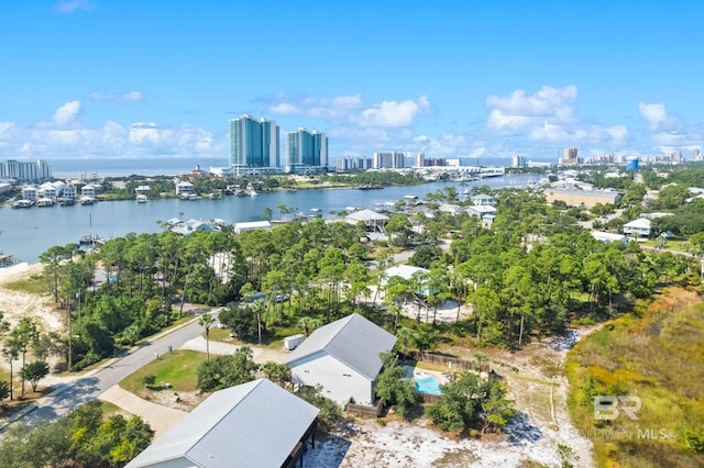 drone / aerial view with a view of city and a water view