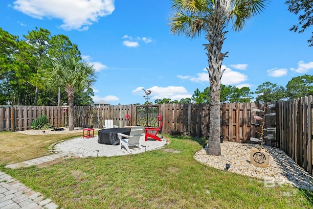 view of yard with an outdoor fire pit and a fenced backyard