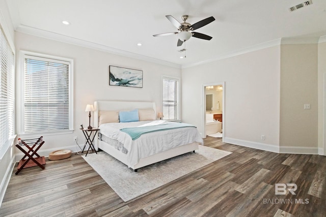 bedroom featuring connected bathroom, ceiling fan, wood-type flooring, and multiple windows