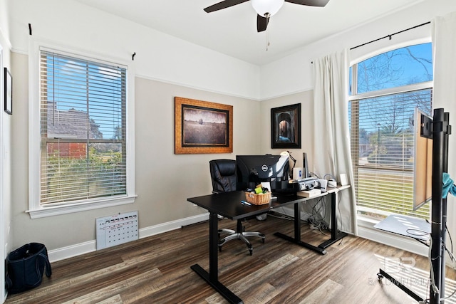 office with ceiling fan and dark wood-type flooring