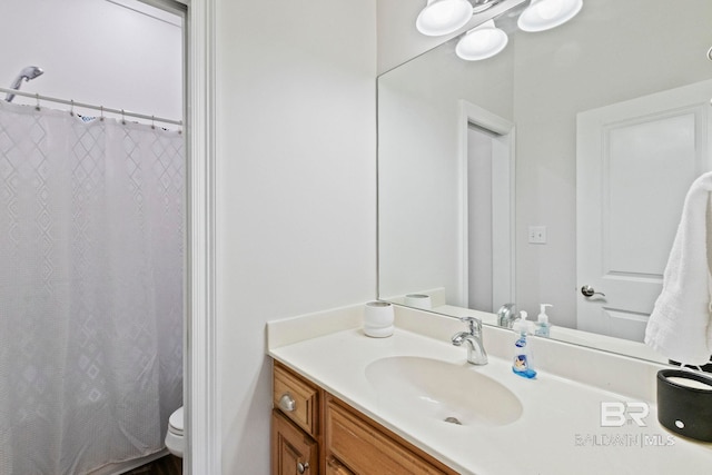 bathroom with vanity and toilet