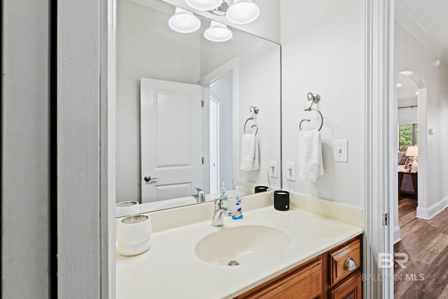 bathroom with hardwood / wood-style floors and vanity