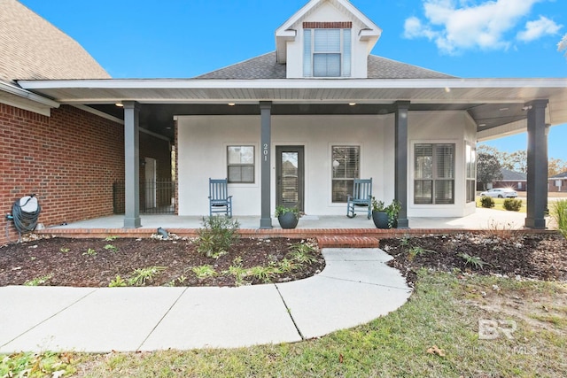 property entrance featuring a porch