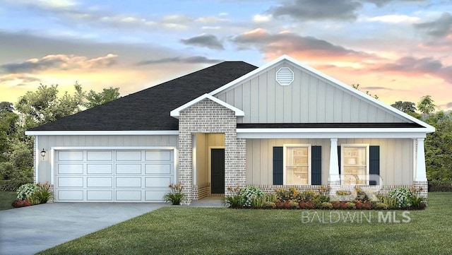 exterior space featuring a garage and a yard