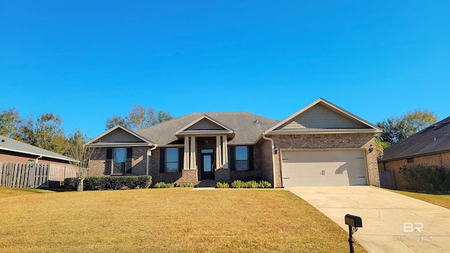 craftsman house featuring a front yard and a garage