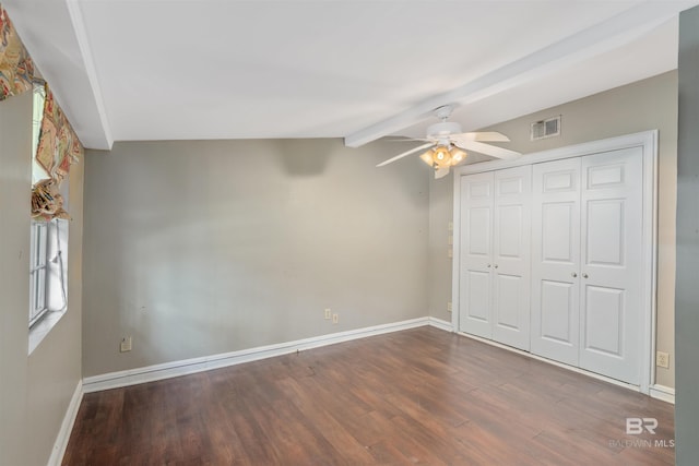 unfurnished bedroom featuring vaulted ceiling with beams, ceiling fan, wood-type flooring, and a closet