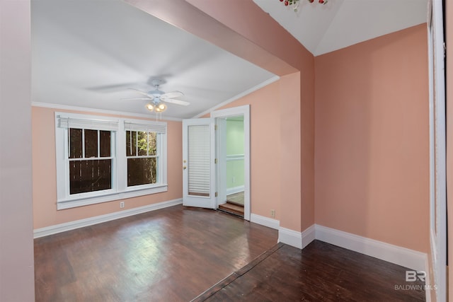 interior space featuring ceiling fan, dark hardwood / wood-style flooring, lofted ceiling, and ornamental molding