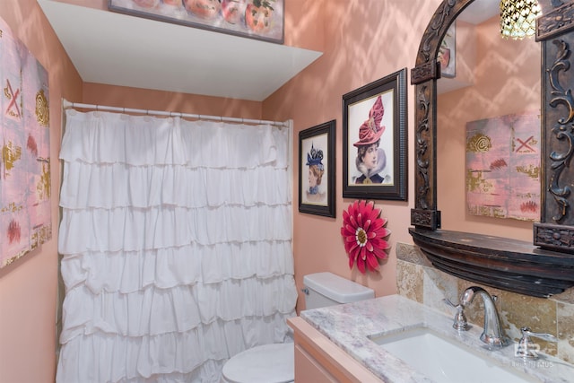 bathroom with vanity, toilet, and walk in shower