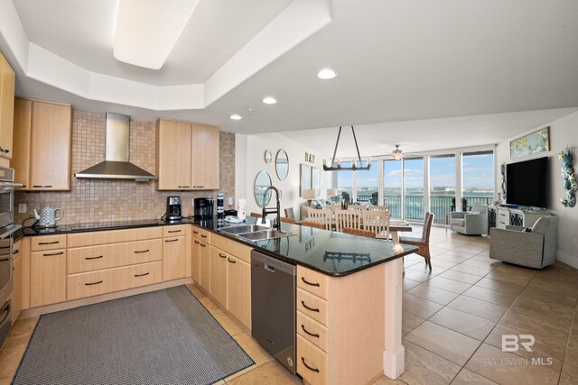 28107 Perdido Beach Blvd Unit D 503, Orange Beach, AL 36561 - kitchen featuring light brown cabinets, a sink, a peninsula, wall chimney range hood, and dishwasher