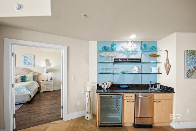 28107 Perdido Beach Blvd Unit D 503, Orange Beach, AL 36561 - bar with baseboards, wine cooler, indoor wet bar, light tile patterned floors, and a sink