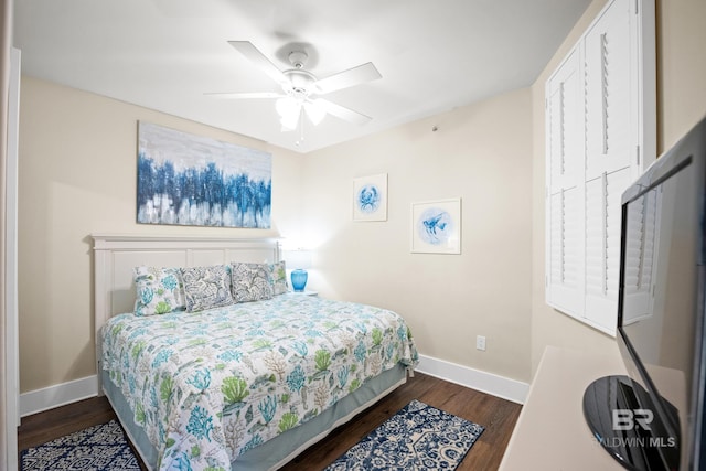 28107 Perdido Beach Blvd Unit D 503, Orange Beach, AL 36561 - bedroom featuring baseboards, dark wood-type flooring, and a ceiling fan
