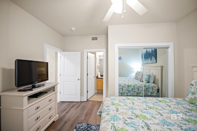 28107 Perdido Beach Blvd Unit D 503, Orange Beach, AL 36561 - bedroom featuring a closet, visible vents, ceiling fan, and wood finished floors