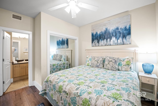 28107 Perdido Beach Blvd Unit D 503, Orange Beach, AL 36561 - bedroom with visible vents, ceiling fan, wood finished floors, a closet, and a sink