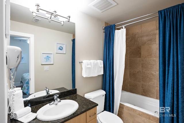 28107 Perdido Beach Blvd Unit D 503, Orange Beach, AL 36561 - ensuite bathroom featuring visible vents, toilet, vanity, and tiled shower / bath