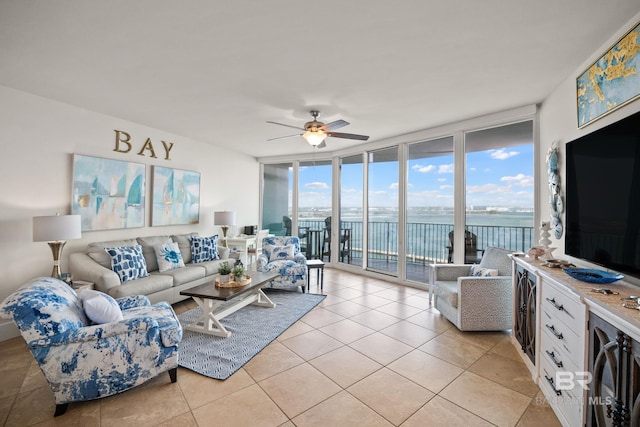 28107 Perdido Beach Blvd Unit D 503, Orange Beach, AL 36561 - living area with a wall of windows, light tile patterned floors, and a ceiling fan