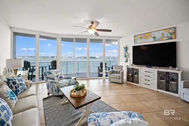 28107 Perdido Beach Blvd Unit D 503, Orange Beach, AL 36561 - living room with light tile patterned floors, ceiling fan, and floor to ceiling windows
