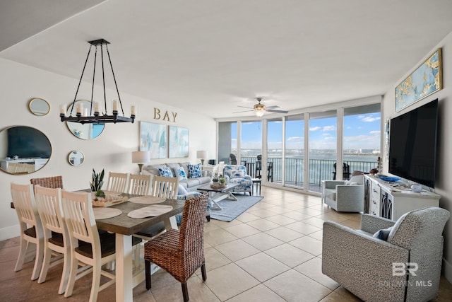 28107 Perdido Beach Blvd Unit D 503, Orange Beach, AL 36561 - dining space featuring light tile patterned floors, floor to ceiling windows, and ceiling fan with notable chandelier