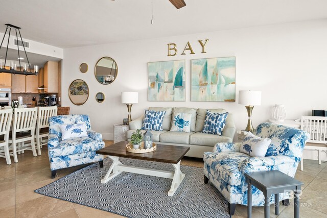 28107 Perdido Beach Blvd Unit D 503, Orange Beach, AL 36561 - living room with tile patterned floors, visible vents, and ceiling fan