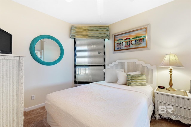 bedroom featuring baseboards and carpet flooring