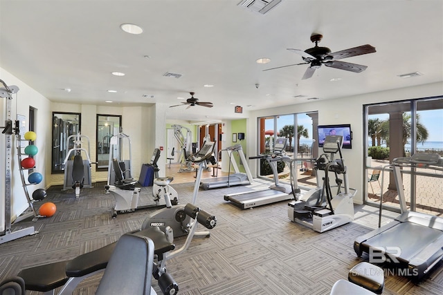 exercise room with carpet flooring and visible vents