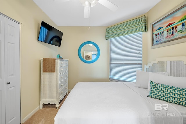 bedroom with carpet flooring, baseboards, and a ceiling fan