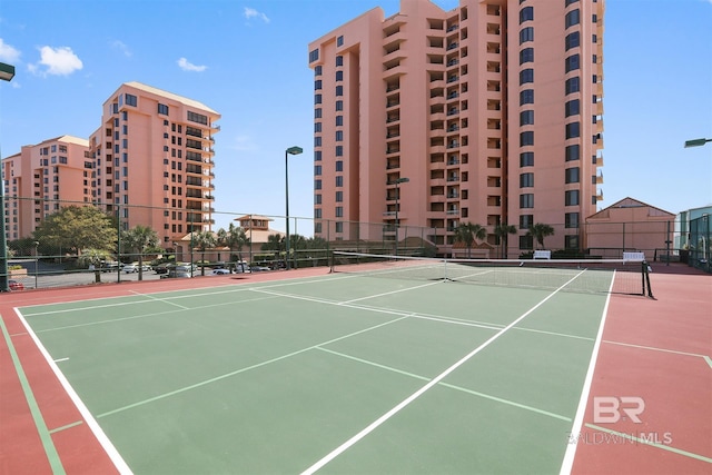 view of sport court with fence