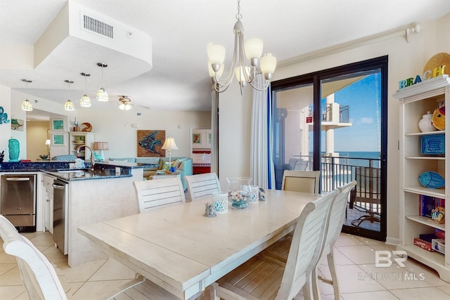 dining space with light tile patterned floors, visible vents, and a chandelier