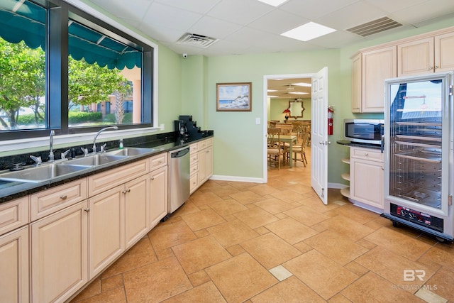 25250 Perdido Beach Blvd Unit 904E, Orange Beach, AL 36561 - kitchen with beverage cooler, visible vents, a sink, a paneled ceiling, and appliances with stainless steel finishes