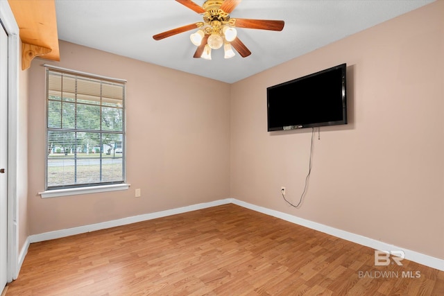 unfurnished room featuring ceiling fan and light hardwood / wood-style flooring