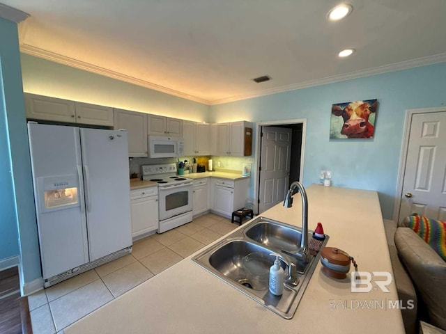 kitchen with white appliances, a sink, light tile patterned floors, recessed lighting, and crown molding