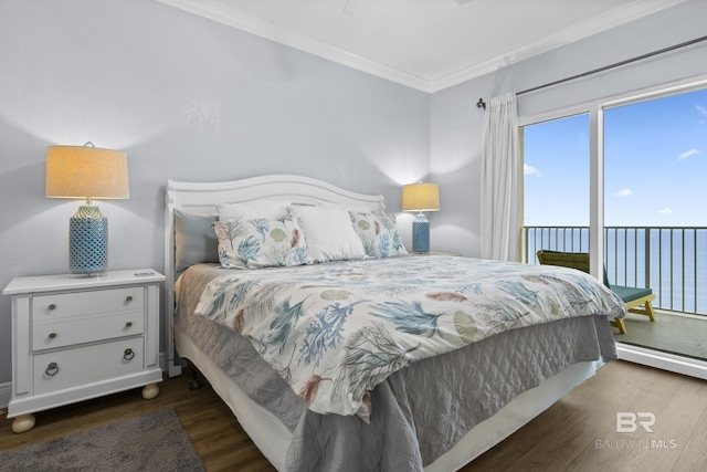 bedroom featuring access to outside, ornamental molding, and wood finished floors
