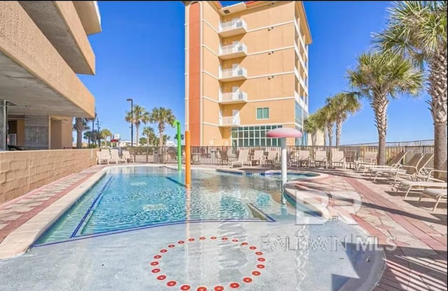 401 E Beach Blvd Unit 1804, Gulf Shores, AL 36542 - community pool featuring a patio
