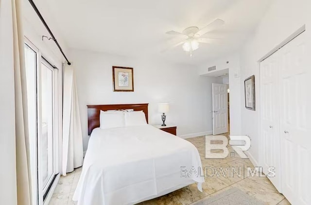 401 E Beach Blvd Unit 1804, Gulf Shores, AL 36542 - bedroom with a ceiling fan and baseboards