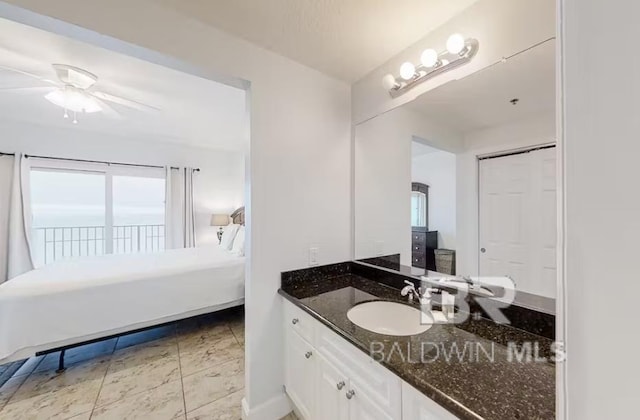 401 E Beach Blvd Unit 1804, Gulf Shores, AL 36542 - bathroom with vanity, a ceiling fan, and connected bathroom