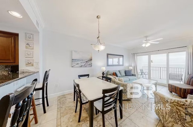 401 E Beach Blvd Unit 1804, Gulf Shores, AL 36542 - dining space featuring a ceiling fan, baseboards, and light tile patterned floors