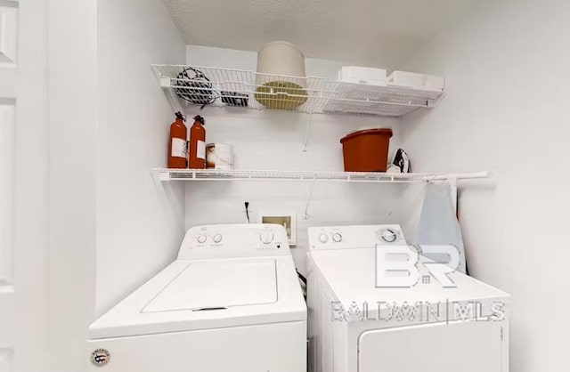 401 E Beach Blvd Unit 1804, Gulf Shores, AL 36542 - washroom featuring washing machine and clothes dryer