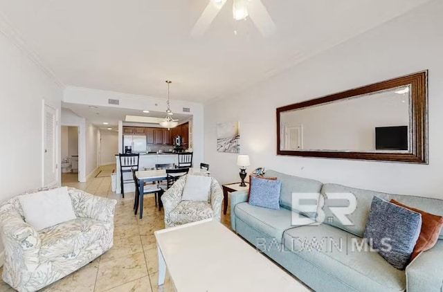 401 E Beach Blvd Unit 1804, Gulf Shores, AL 36542 - living room with ceiling fan and crown molding