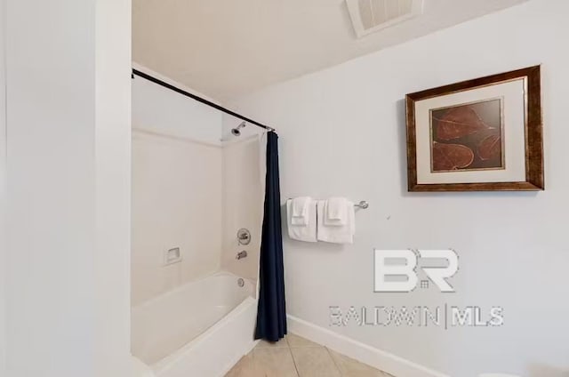 401 E Beach Blvd Unit 1804, Gulf Shores, AL 36542 - full bath with baseboards, tile patterned flooring, and shower / tub combo with curtain