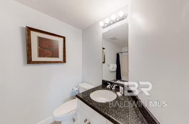 401 E Beach Blvd Unit 1804, Gulf Shores, AL 36542 - bathroom featuring vanity, toilet, and baseboards