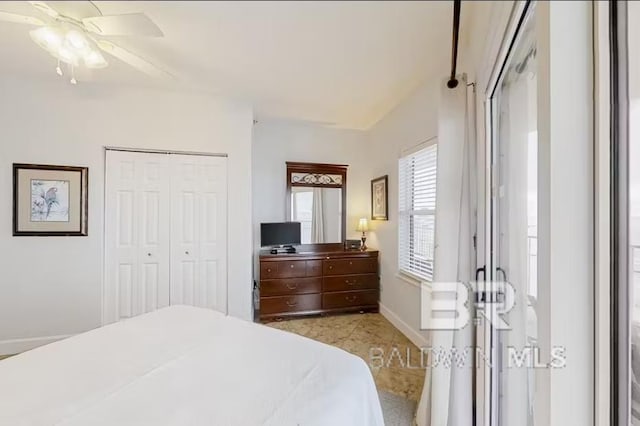 401 E Beach Blvd Unit 1804, Gulf Shores, AL 36542 - bedroom featuring a closet, a ceiling fan, and baseboards